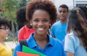 Smiling Student Holding Books